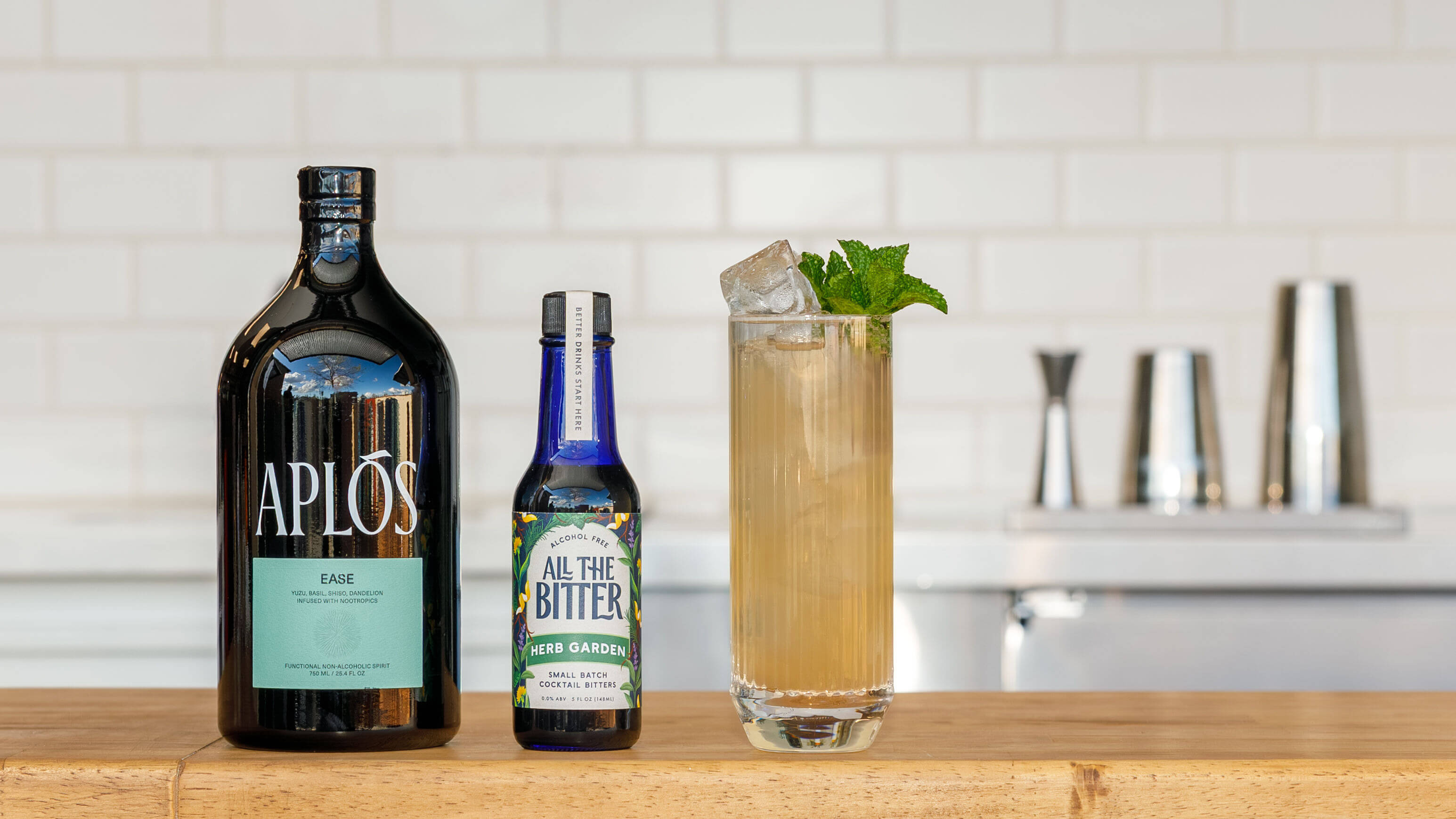 Nonalcoholic collins made with aplos ease and herb garden bitters.